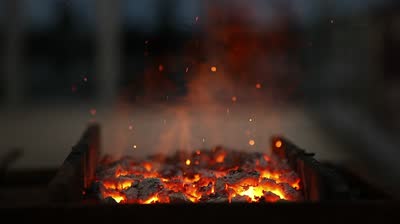 stock footage sparks from flaming coals close shot